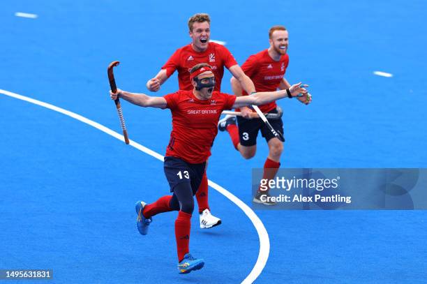 Sam Ward of Great Britain celebrates with team mates after scoring his sides fourth goal during the FIH Hockey Pro League Men's match between Great...