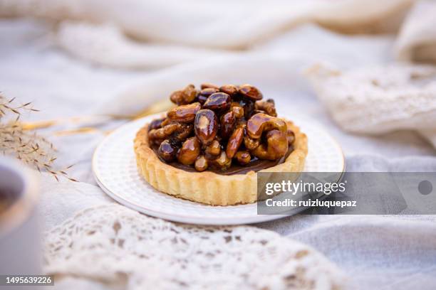 dulce de leche and caramelized dried fruits pie - sugared almond stock pictures, royalty-free photos & images