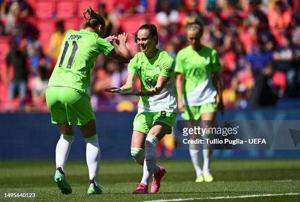 Ewa Pajor of VfL Wolfsburg celebrates with teammate Alexandra Popp after scoring the team's first goal during the UEFA Women's Champions League final...