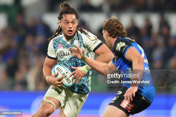 Naitoa Ah Kuoi of the Chiefs looks to make his way past the defender during the round 15 Super Rugby Pacific match between Western Force and Chiefs...