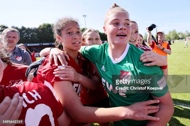 Marie Omoze Okoroh and Paula Blum of Aurich n celebrates with her team after winning 7-6 the penalty shoot-out of the B-Junior Girls Final German...