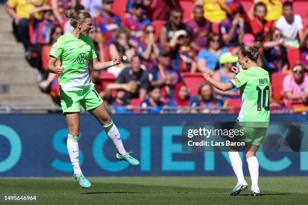 Alexandra Popp of VfL Wolfsburg celebrates with teammates Svenja Huth and Felicitas Rauch after scoring the team's second goal during the UEFA...