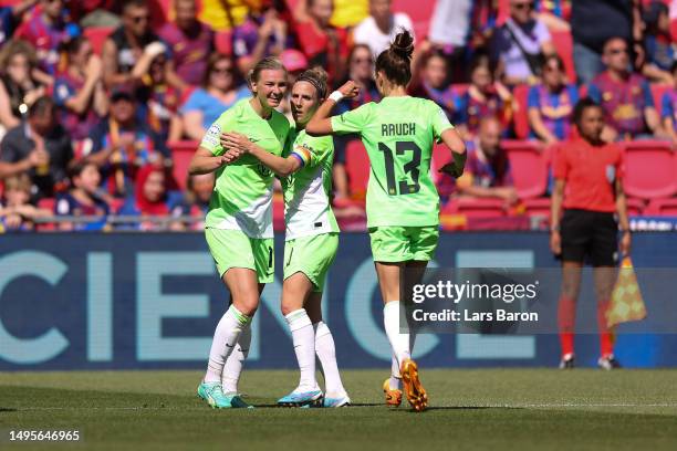 Alexandra Popp of VfL Wolfsburg celebrates with teammates Svenja Huth and Felicitas Rauch after scoring the team's second goal during the UEFA...