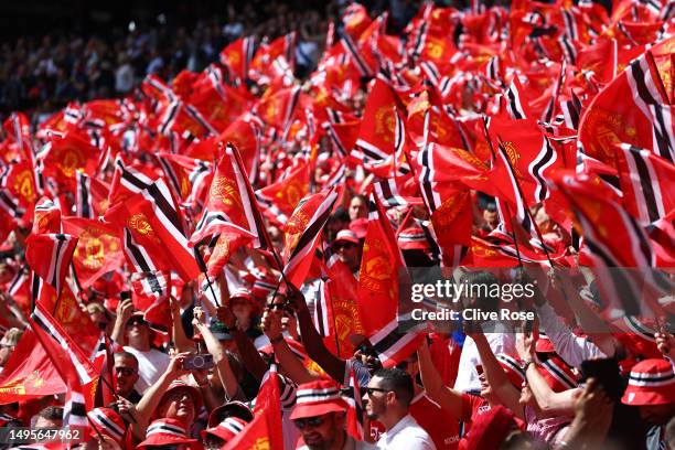 Manchester United fans show their support with flags prior to the Emirates FA Cup Final between Manchester City and Manchester United at Wembley...