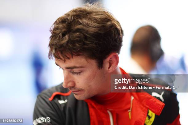 19th Placed qualifier Charles Leclerc of Monaco and Ferrari looks on in the garage during qualifying ahead of the F1 Grand Prix of Spain at Circuit...