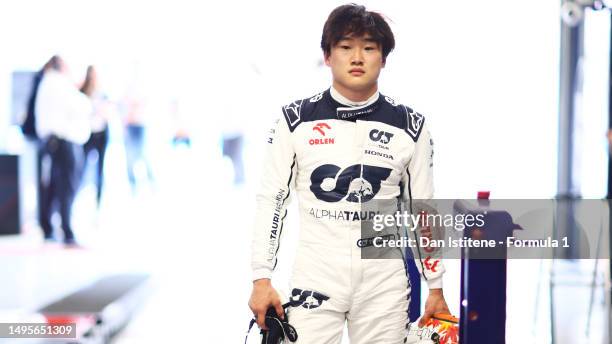 15th placed qualifier Yuki Tsunoda of Japan and Scuderia AlphaTauri looks on in the garage during qualifying ahead of the F1 Grand Prix of Spain at...