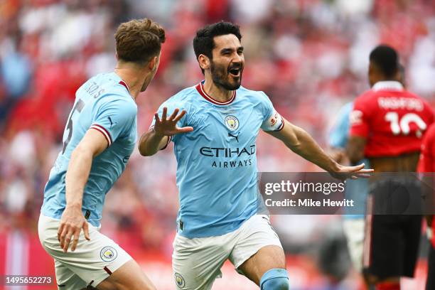 Ilkay Guendogan of Manchester City celebrates after scoring the team's second goal alongside teammate John Stones during the Emirates FA Cup Final...