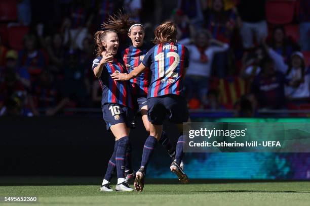 Patri Guijarro of FC Barcelona celebrates with teammates after scoring the team's first goal during the UEFA Women's Champions League final match...