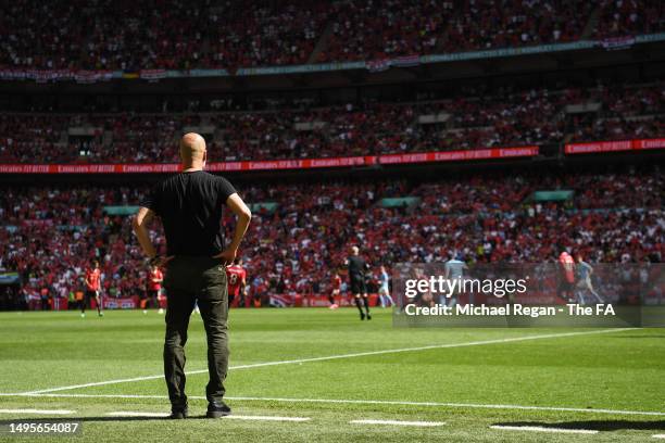 Pep Guardiola, Manager of Manchester City, looks on at play during the Emirates FA Cup Final between Manchester City and Manchester United at Wembley...