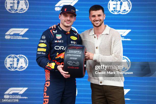 Pole position qualifier Max Verstappen of the Netherlands and Oracle Red Bull Racing is presented with the Pirelli Pole Position award by Mason Mount...