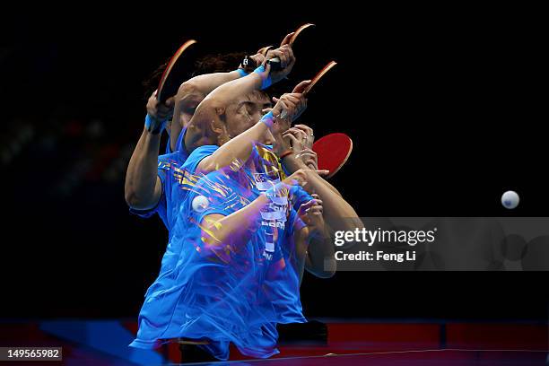 Tianwei Feng of Singapore plays a backhand during the Women's Singles Table Tennis quarter-final match against Kyung Ah Kim of Korea on on Day 4 of...