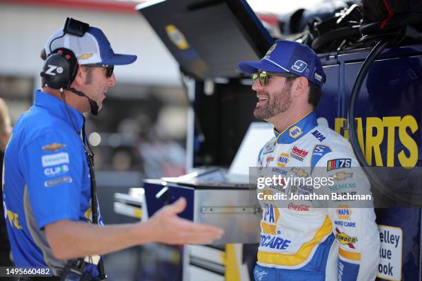 Corey LaJoie, driver of the NAPA Auto Parts Chevrolet, and crew chief Alan Gustafson talk on the grid during practice for the NASCAR Cup Series Enjoy...