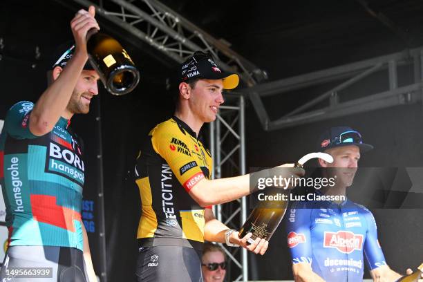 Jordi Meeus of Belgium and Team BORA - hansgrohe on second place, race winner Olav Kooij of The Netherlands and Team Jumbo-Visma and Robbe Ghys of...