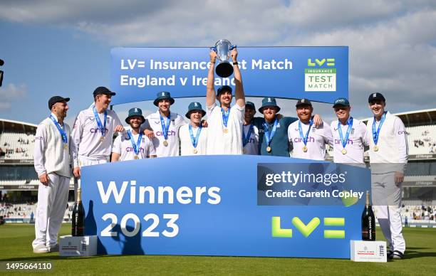 Josh Tongue of England lifts the series trophy alongside teammates after winning the LV= Insurance Test Match between England and Ireland at Lord's...