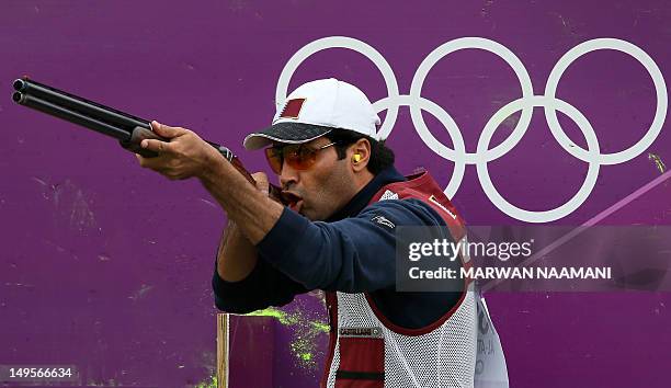 Nasser al-Attiya of Qatar competes in the men's skeet shooting qualification of the London 2012 Olympic Games at the Royal Artillery Barracks in...