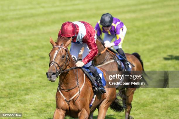 Jockey, Harry Davies on Sheer Rocks competes in The Rio Ferdinand Foundation Northern Dancer Handicap Stakes during the Epsom Races at Epsom Downs...