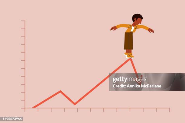 a young man balances carefully on a line graph as it crashes downward - moving down stock illustrations