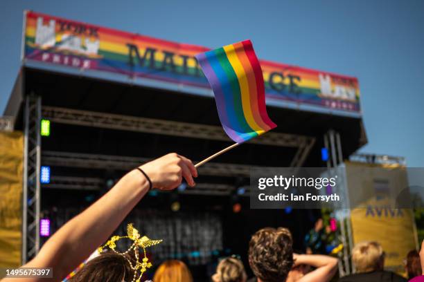 Pride flag is waved during the York pride festival on June 03, 2023 in York, England. York Pride is North Yorkshire's biggest LGBT+ celebration. The...