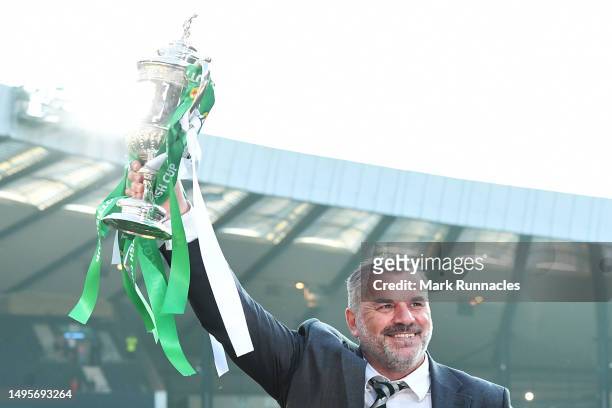 Angelos Postecoglou, Manager of Celtic lifts the Scottish Cup trophy after the team's victory during the Scottish Cup Final between Celtic and...