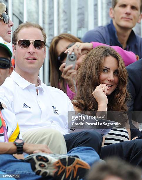 Prince William, Duke of Cambridge and Catherine, Duchess of Cambridge look on during the Show Jumping Eventing Equestrian on Day 4 of the London 2012...