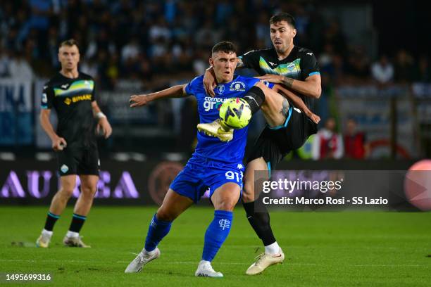 Alessio Romagnoli of SS Lazio compete for the ball with Roberto Piccoli of Empoli FC during the Serie A match between Empoli FC and SS Lazio at...