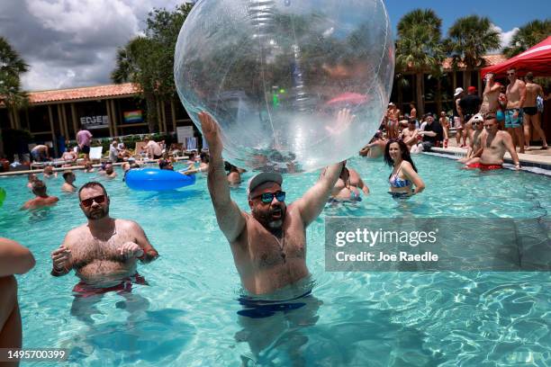 People relax at the pool during the Gay Days festivities at the DoubleTree by Hilton Orlando at SeaWorld on June 03, 2023 in Orlando, Florida. As...