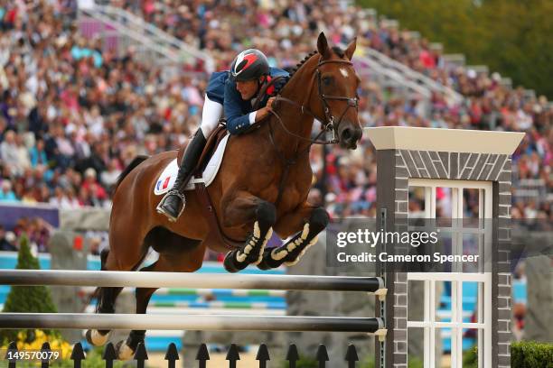 Nicolas Touzaint of France riding Hildago de Lile in action in the Show Jumping Equestrian event on Day 4 of the London 2012 Olympic Games at...