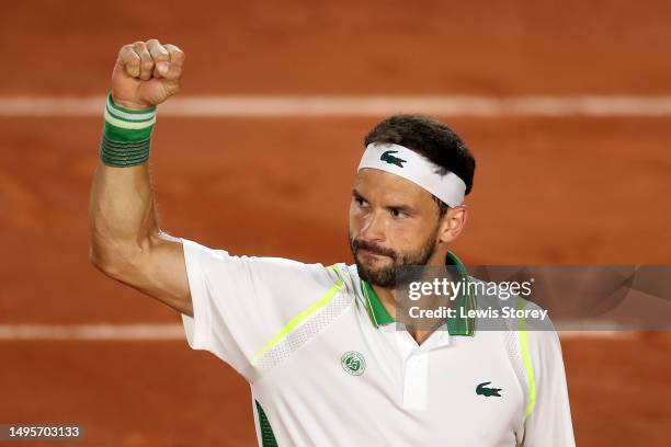 Grigor Dimitrov of Bulgaria celebrates winning match point against Daniel Altmaier of Germany in the Men's Singles Third Round Match on Day Seven of...