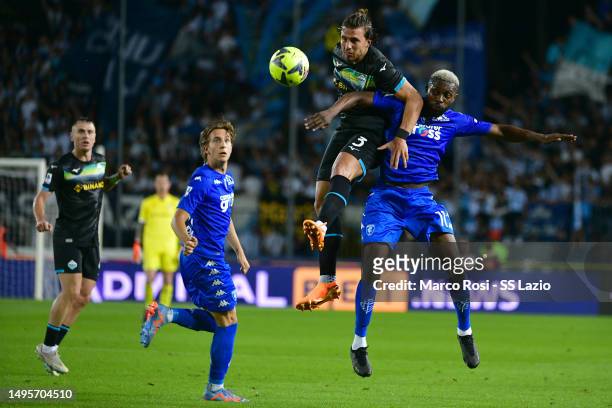 Luca Pellegrini of SS Lazio compete for the ball with Daniel Akpa Akpro of Empoli FC during the Serie A match between Empoli FC and SS Lazio at...