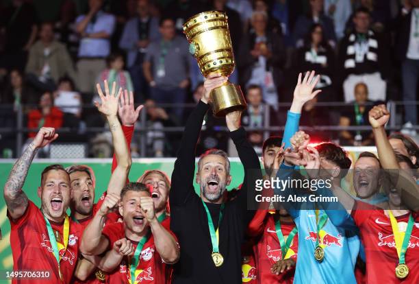 Marco Rose, Head Coach of RB Leipzig, lifts the DFB Cup trophy after the team's victory during the DFB Cup final match between RB Leipzig and...