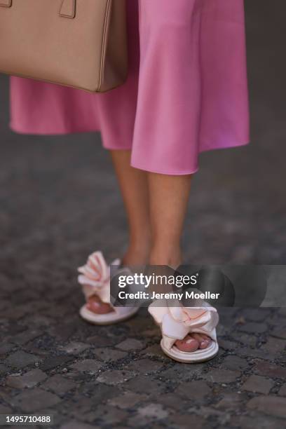 Lea Naumann wearing Acne Studios satin beige rose flower heels, Samsoe Samsoe pink satin midi skirt, Gestuz orange red tshirt and Prada Galleria...