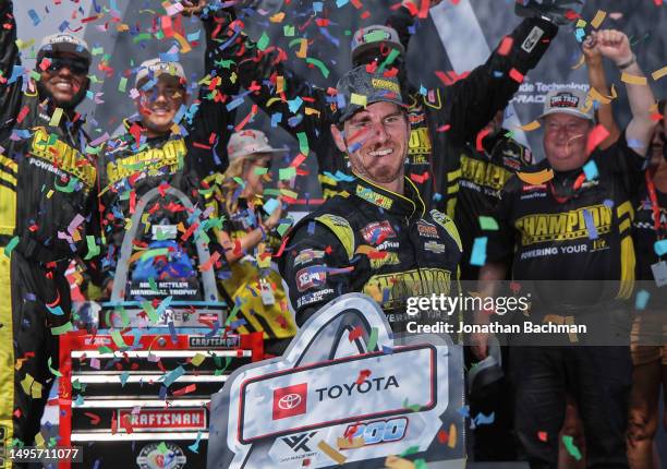 Grant Enfinger, driver of the Champion Power Equipment Chevrolet, celebrates in victory lane after winning the NASCAR Craftsman Truck Series Toyota...