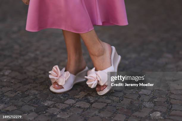 Lea Naumann wearing Acne Studios satin beige rose flower heels, Samsoe Samsoe pink satin midi skirt, Gestuz orange red tshirt and Prada Galleria...