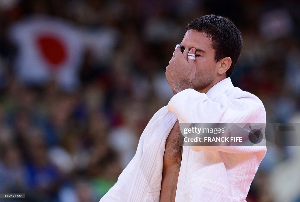 Brazil's Leandro Guilheiro reacts after 