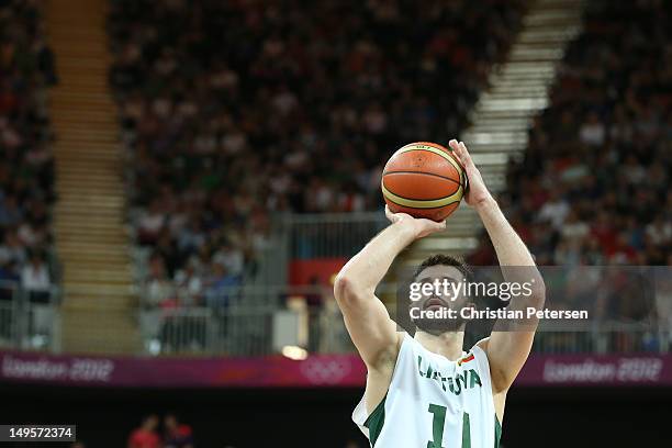 Linas Kleiza of Lithuania shoots a free throw in the Men's Basketball Preliminary Round match between Lithuania and Nigeria on Day 4 of the London...