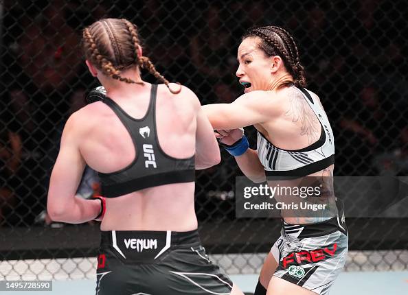Alice Reed Ufc Jinh Yu Frey punches Elise Reed in a strawweight bout during the UFC ...