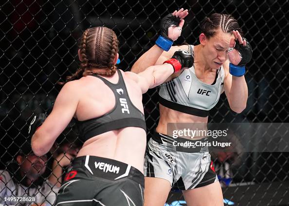 Alice Reed Ufc Elise Reed punches Jinh Yu Frey in a strawweight bout during the UFC ...