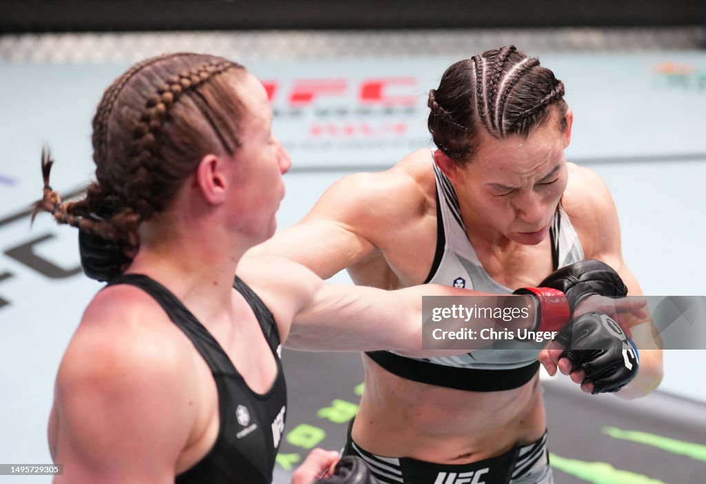 Alice Reed Ufc Elise Reed punches Jinh Yu Frey in a strawweight bout during the UFC ...