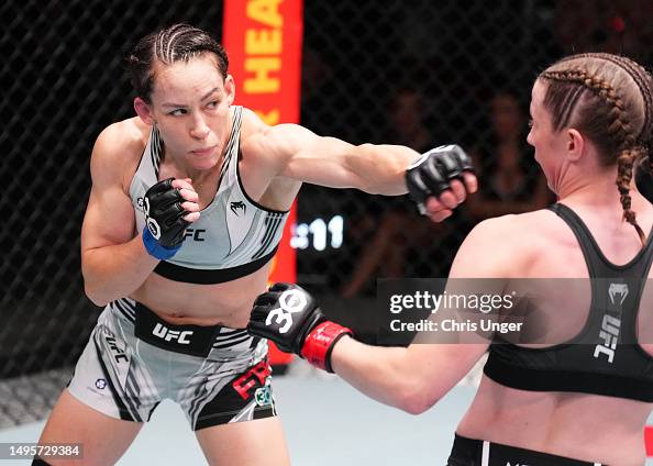 Alice Reed Ufc Jinh Yu Frey punches Elise Reed in a strawweight bout during the UFC ...