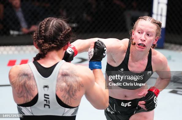 Alice Reed Ufc Elise Reed punches Jinh Yu Frey in a strawweight bout during the UFC ...