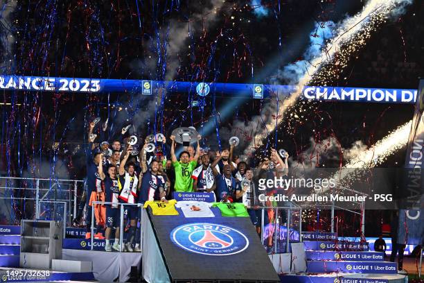 Paris Saint-Germain Captain Marquinhos raises the France championship trophy after the Ligue 1 match between Paris Saint-Germain and Clermont Foot at...