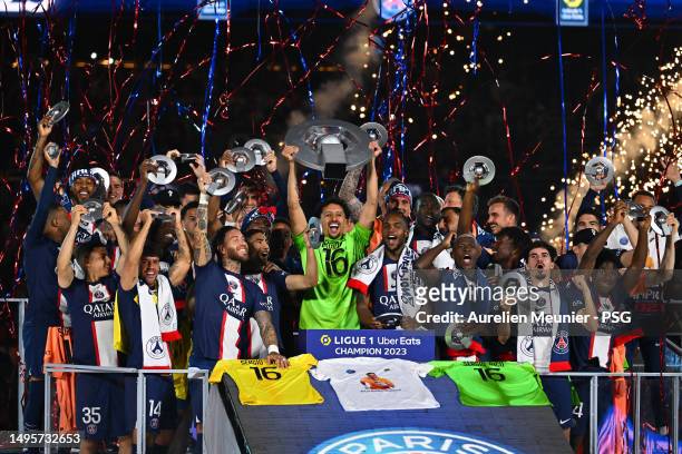 Paris Saint-Germain Captain Marquinhos raises the France championship trophy after the Ligue 1 match between Paris Saint-Germain and Clermont Foot at...