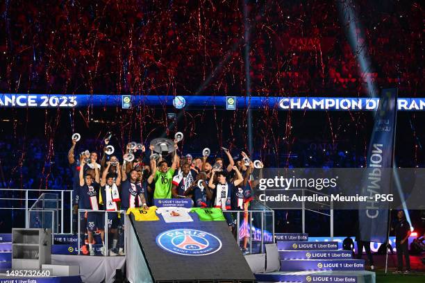 Paris Saint-Germain Captain Marquinhos raises the France championship trophy after the Ligue 1 match between Paris Saint-Germain and Clermont Foot at...