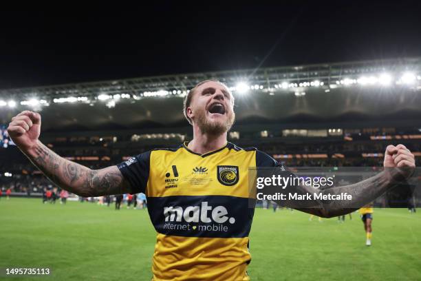 Jason Cummings of the Mariners celebrates with fans after winning the 2023 A-League Men's Grand Final match between Melbourne City and Central Coast...