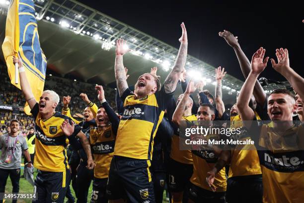 Jason Cummings of the Mariners celebrates with fans after winning the 2023 A-League Men's Grand Final match between Melbourne City and Central Coast...