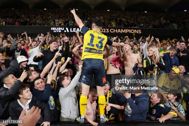 Harrison Steele of the Mariners celebrates with fans after winning the 2023 A-League Men's Grand Final match between Melbourne City and Central Coast...