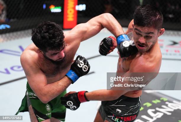 Muin Gafurov of Tajikistan punches John Castaneda in a bantamweight bout during the UFC Fight Night event at UFC APEX on June 03, 2023 in Las Vegas,...