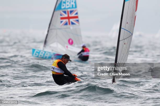 Jonas Hogh-Christensen of Denmark and Ben Ainslie of Great Britain compete in the Men's Finn Sailing on Day 4 of the London 2012 Olympic Games at...