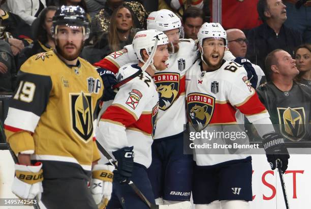 Eric Staal of the Florida Panthers is congratulated by his teammates after scoring a goal against the Vegas Golden Knights as Reilly Smith reacts...