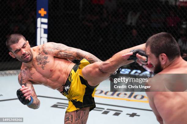 Elizeu Zaleski dos Santos of Brazil kicks Abubakar Nurmagomedov of Russia in a welterweight bout during the UFC Fight Night event at UFC APEX on June...